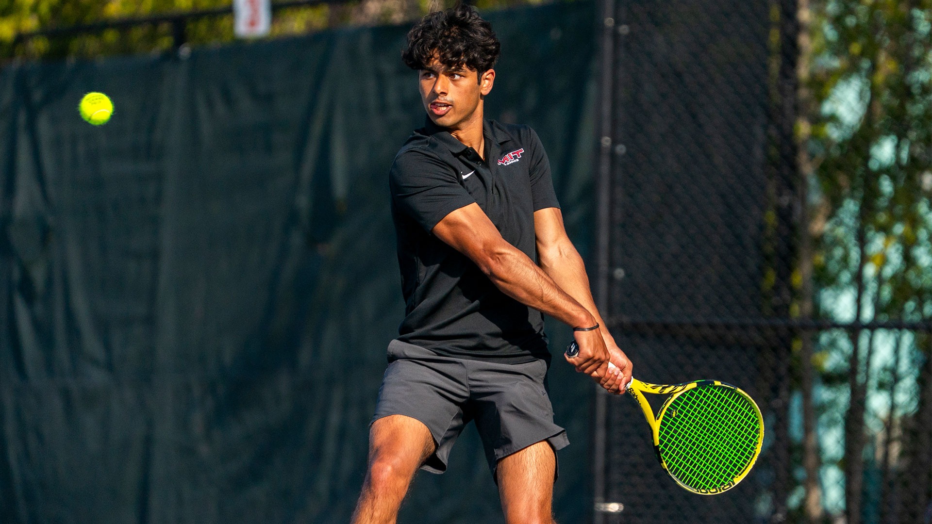 Shrish Choudhary hitting a tennis ball