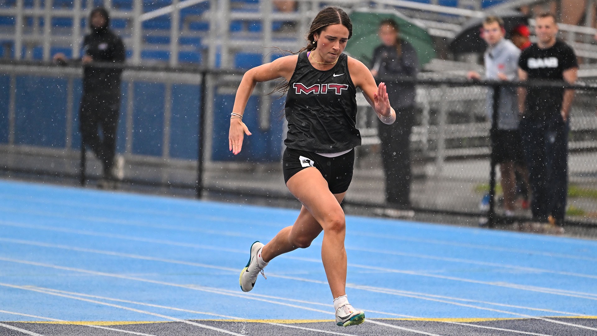 JoJo Miller running on a track