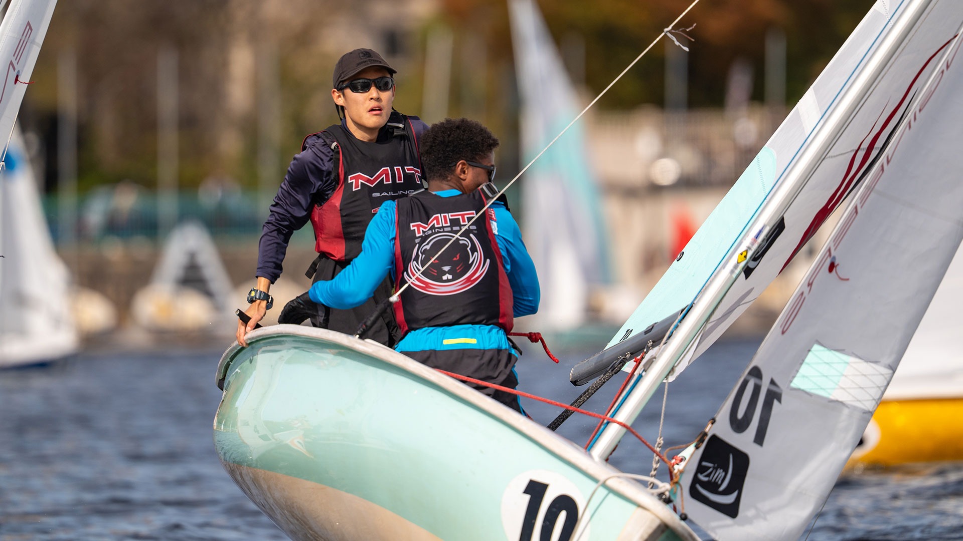 Andy Yu and Ade Larsen on a sailboat