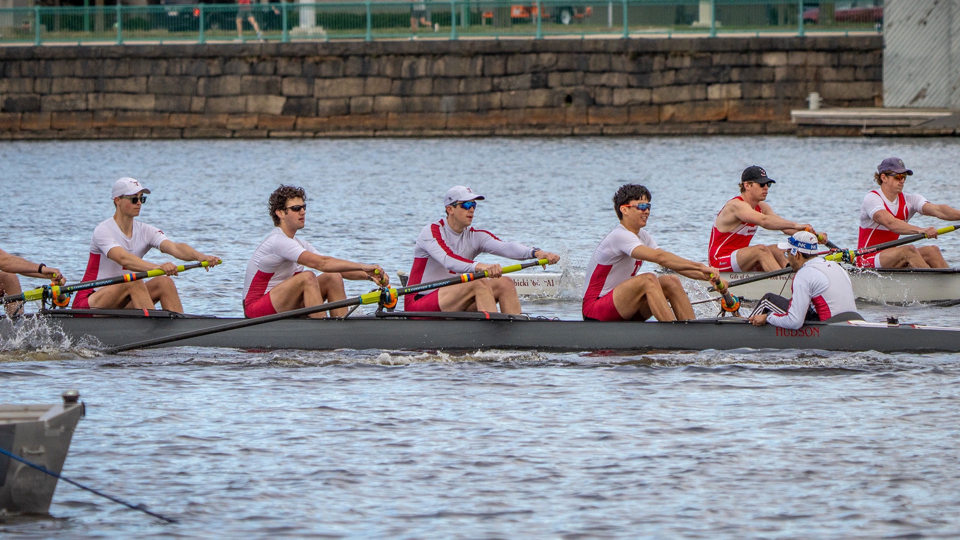 MIT men's heavyweight varsity eight rowing in a boat