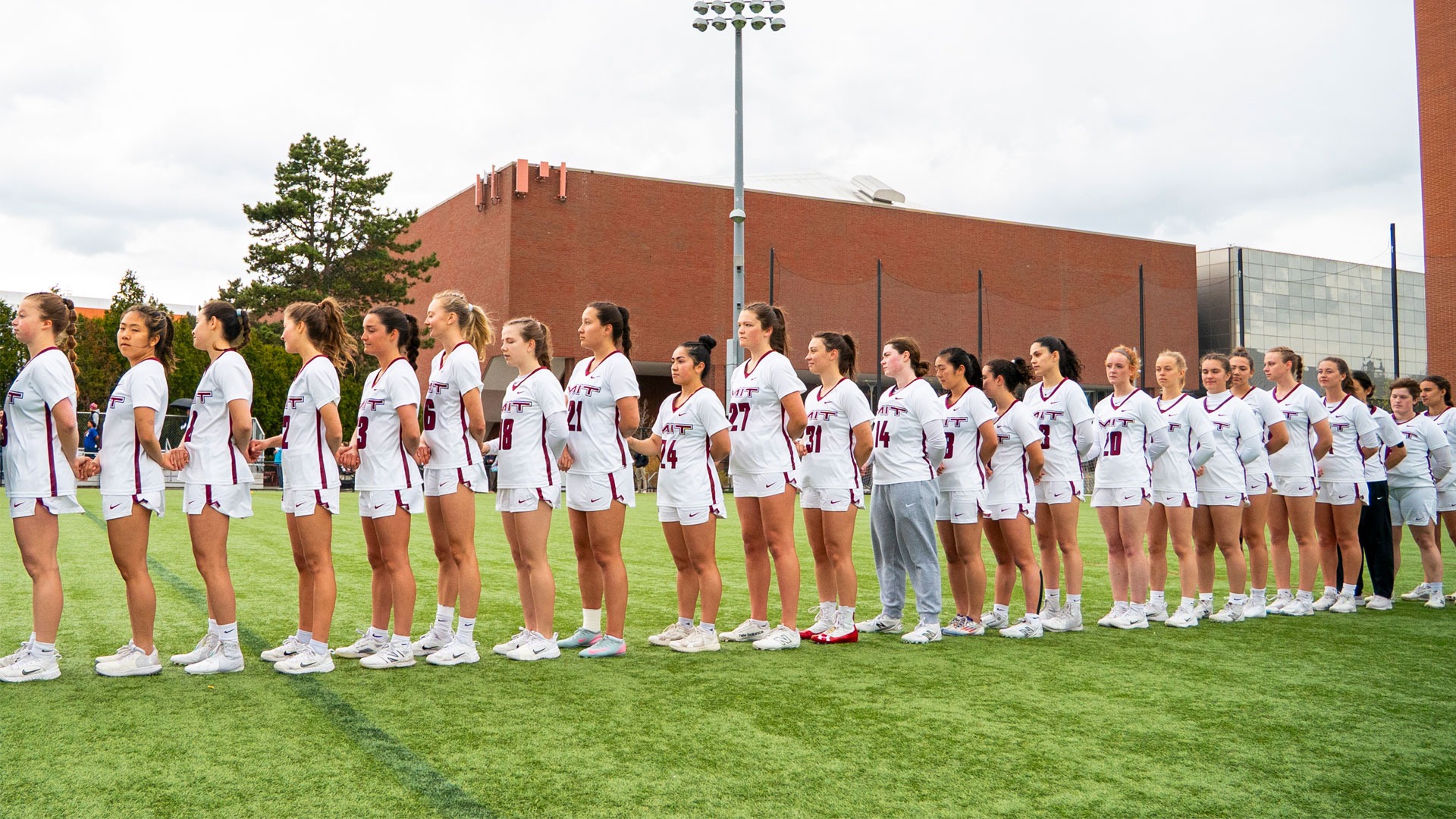 The women's lacrosse team standing in a line