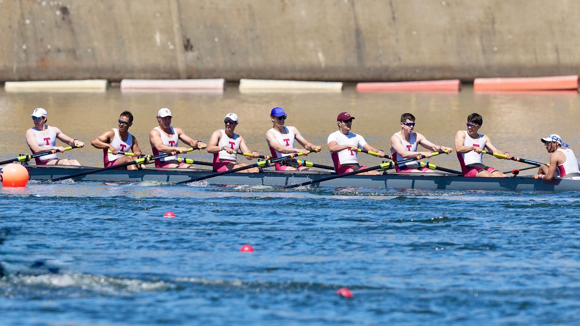 men's heavyweight varsity eight rowing on the water