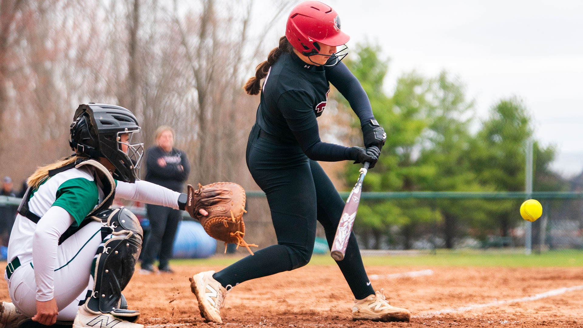 Julia Mattiace swinging the bat