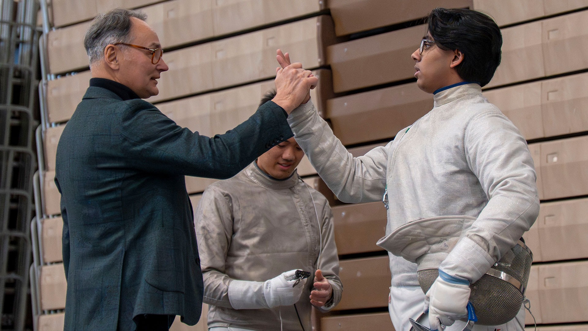 Jarek Koniusz high-fiving Surya Sakhamuri
