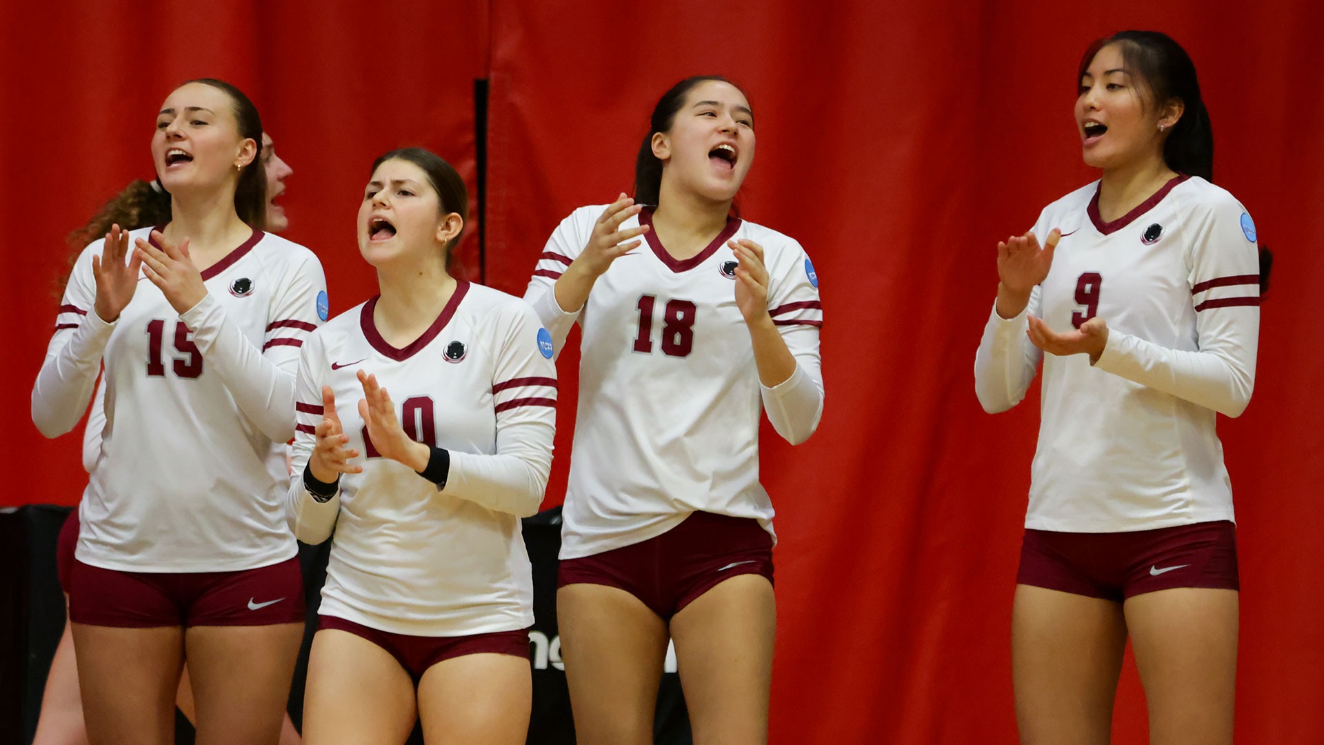Members of the MIT women's volleyball team cheering