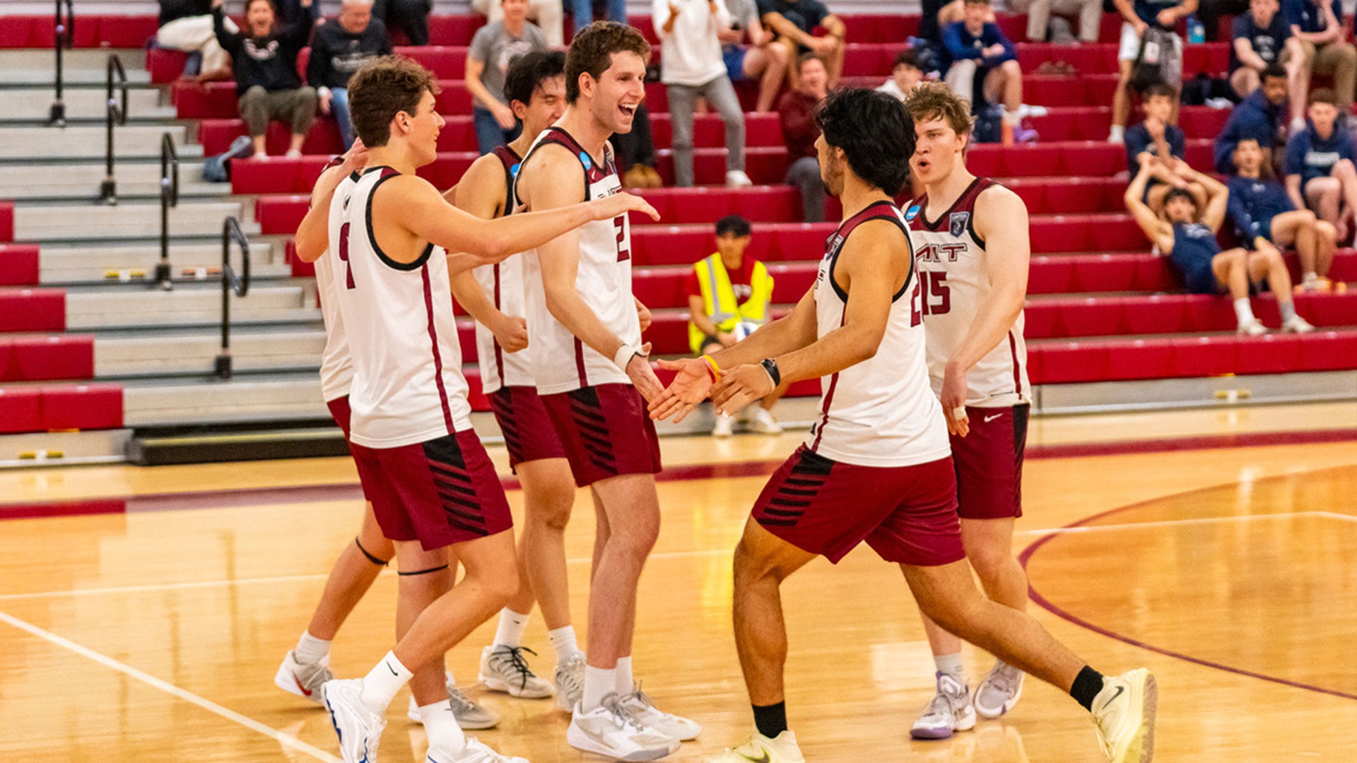 The MIT men's volleyball team celebrating