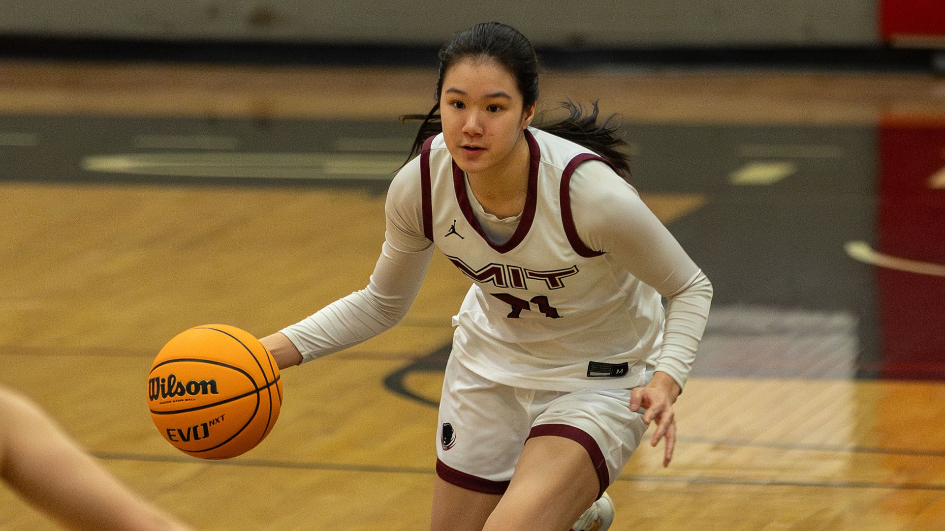 April Chan dribbling a basketball