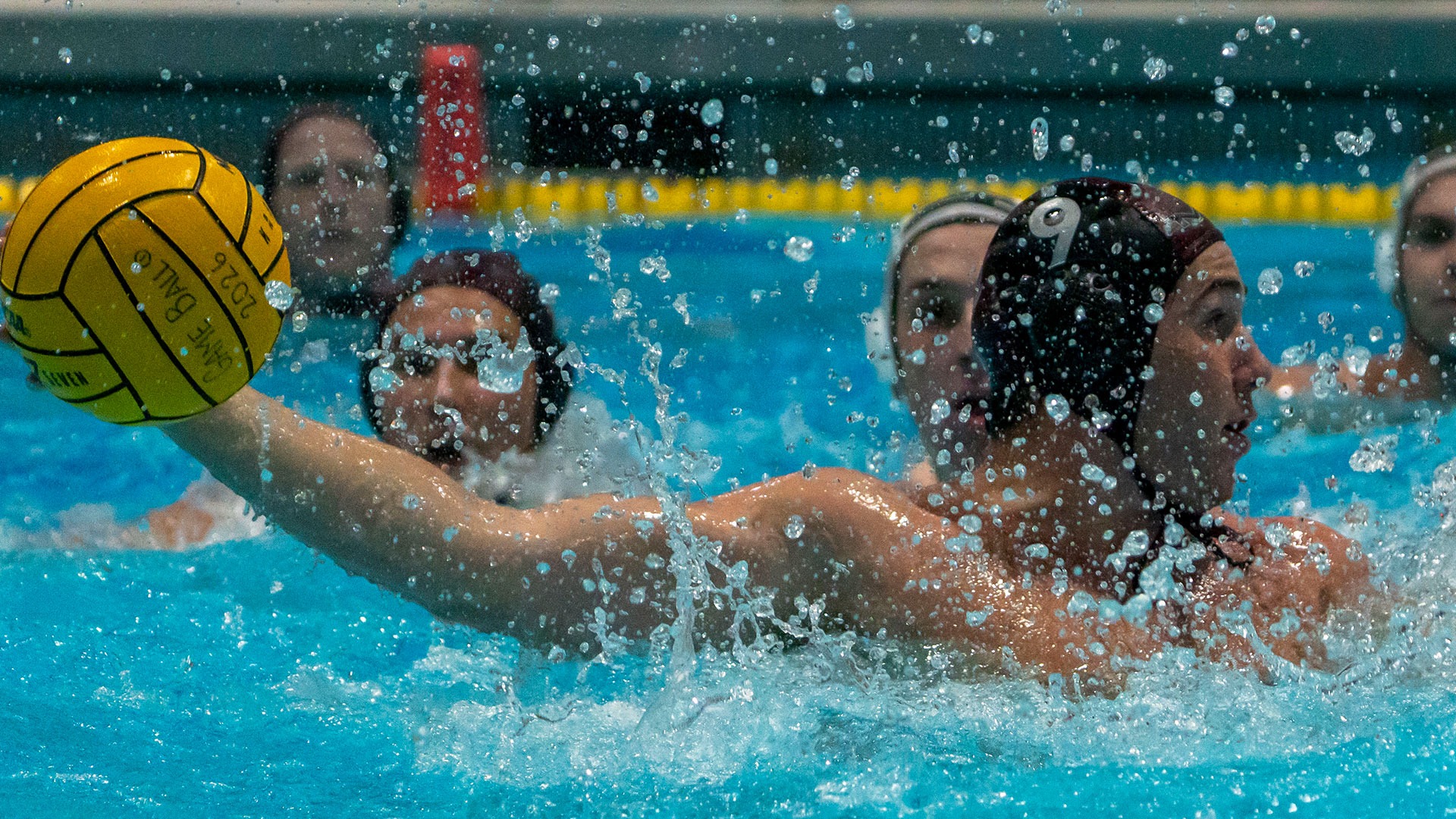 Andras Beleznay preparing to shoot a waterpolo ball