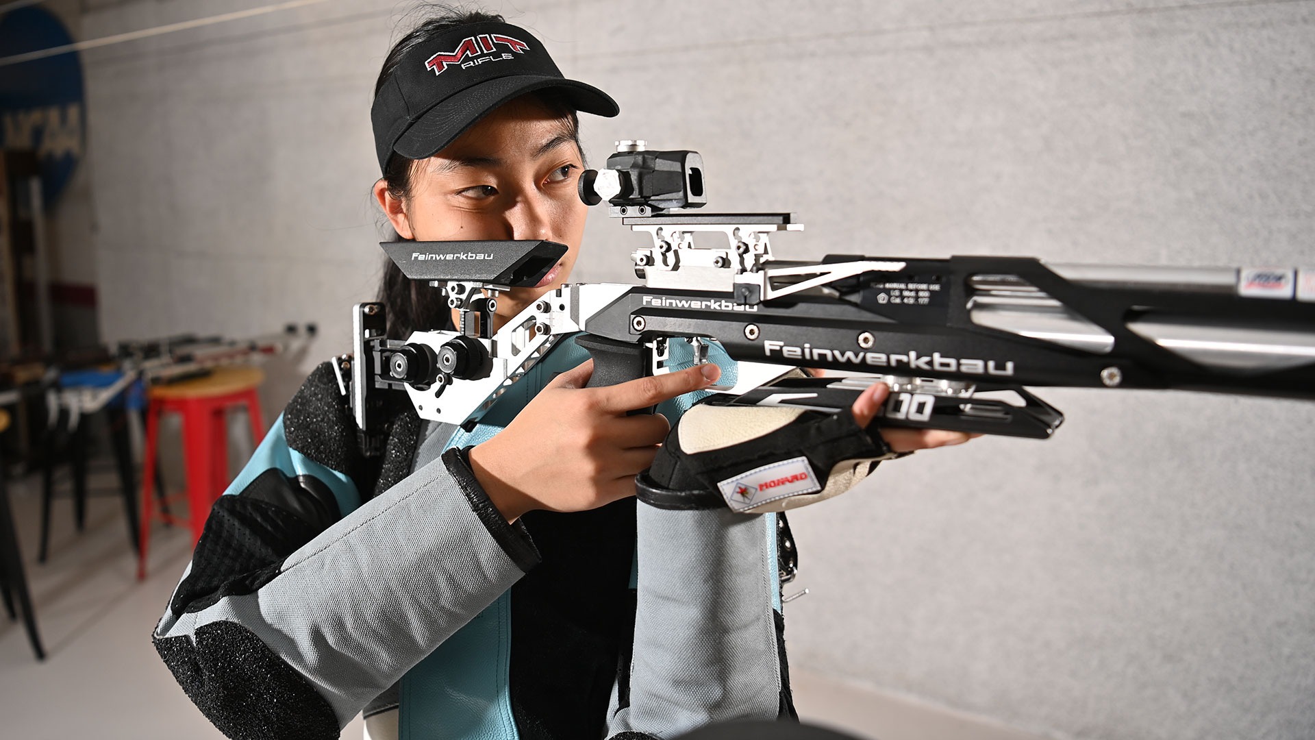 Eleanor Yang aiming her rifle down range