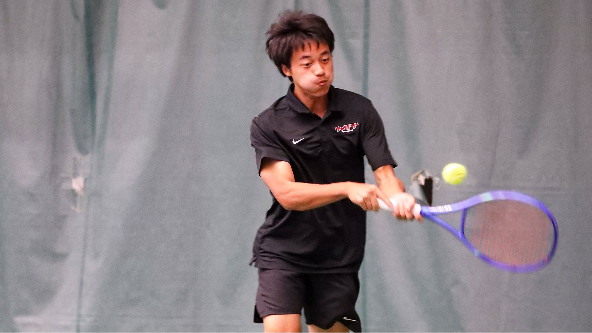 Gary Jiang hitting a backhand shot
