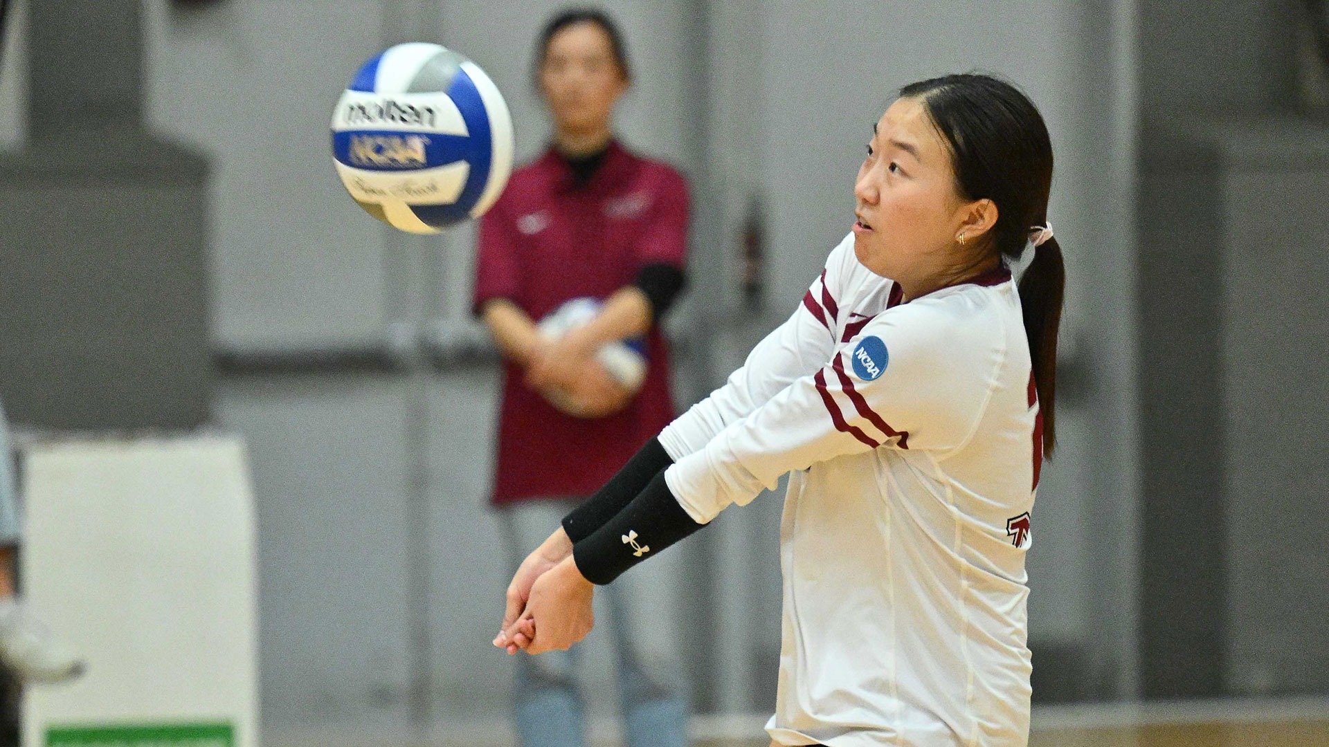 Sophia Song digging the volleyball