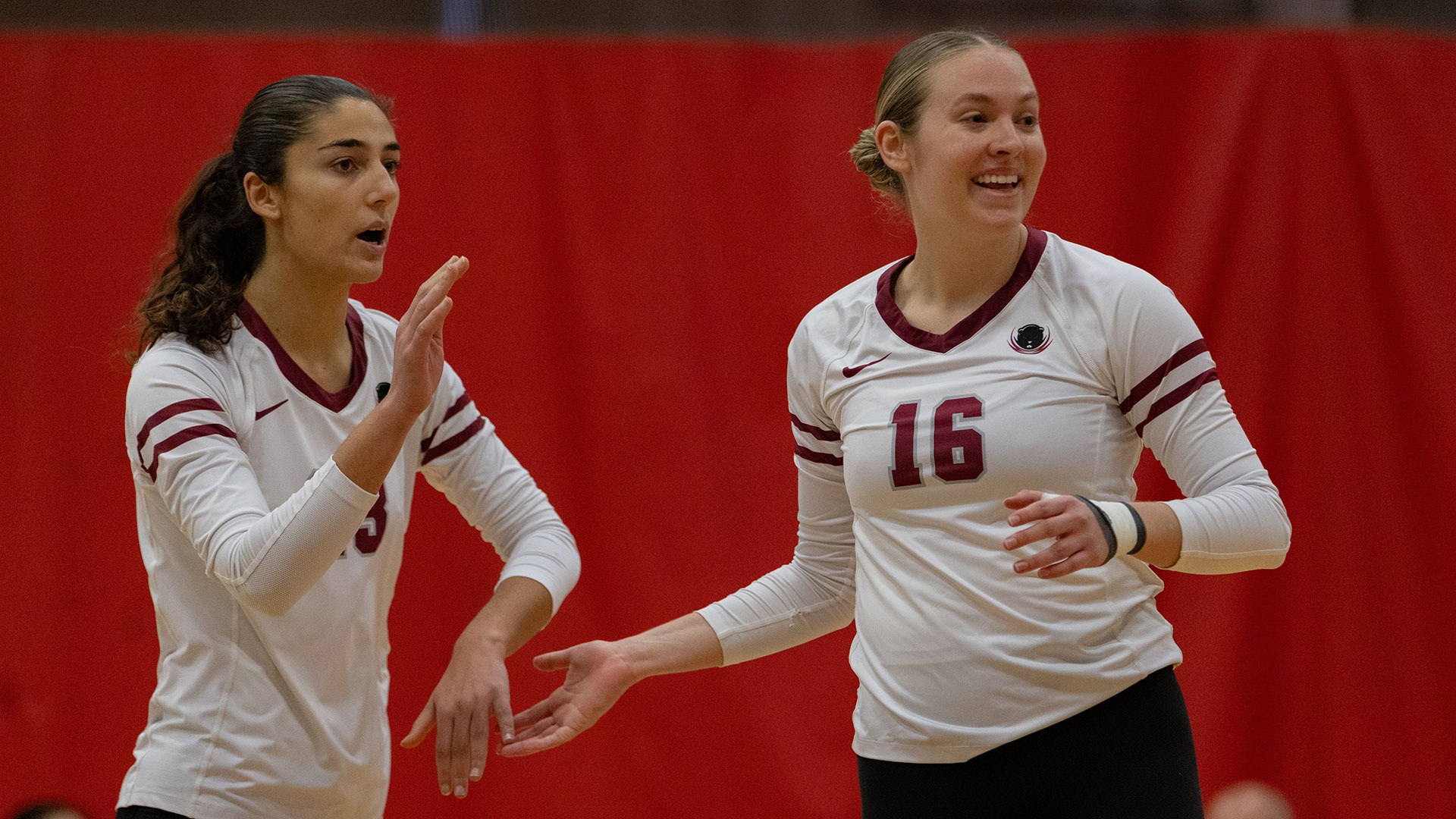 Eileen Sadati and Kayleigh May celebrating after winning a point