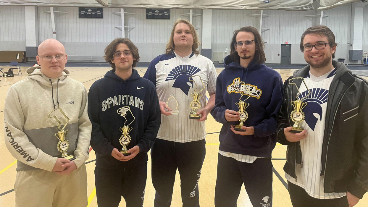 Esports celebrates with its trophies