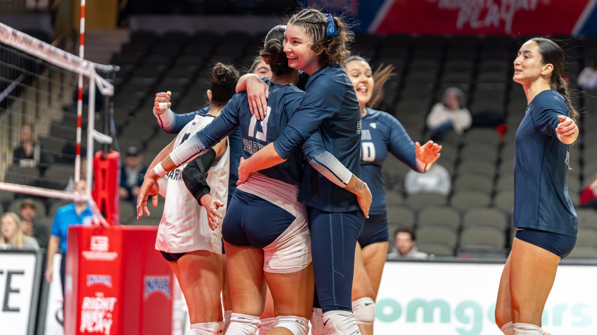 Gabi Jakubowska hugs Allana Capella in Pool E Play (12-4-25)