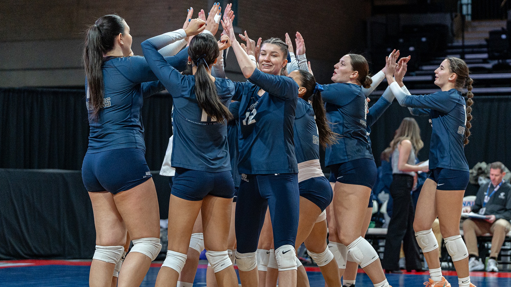 Gabi Jakubowska high-fives teammates before University of Mobile