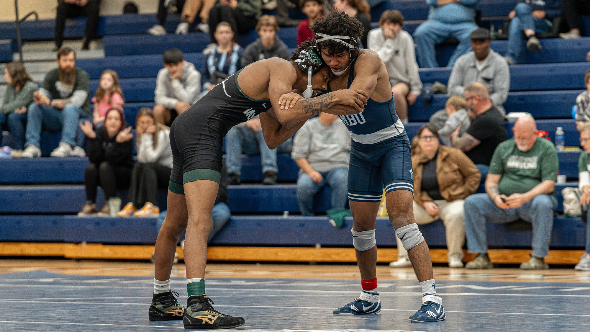 Mills drives in underhook on opponent from William Woods (Mo.)