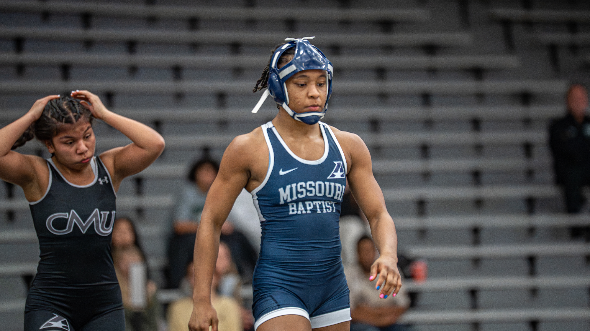 Young walks back to the center of the mat