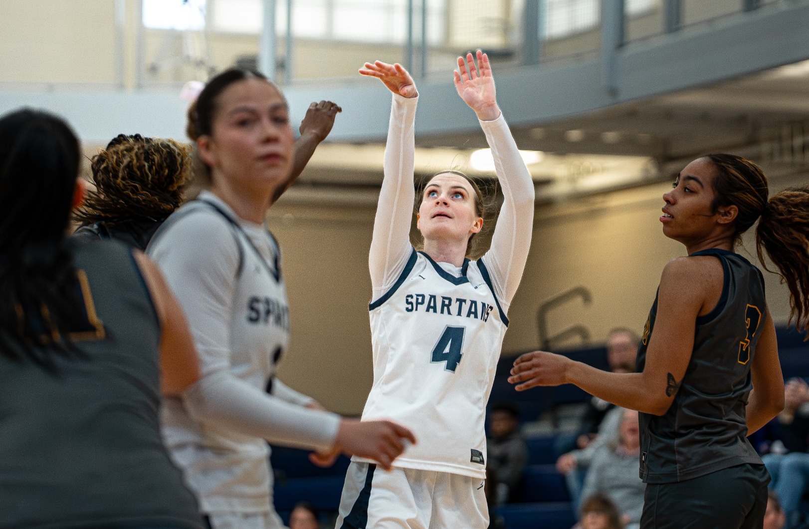 Abby Williams Shooting Basketball Postseason Article 