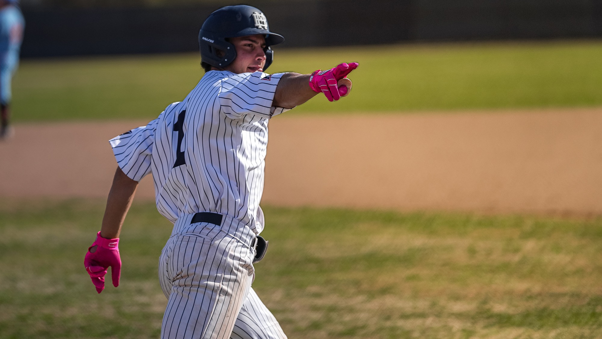 Max Shabestari points to the dugout after a home run vs Baker