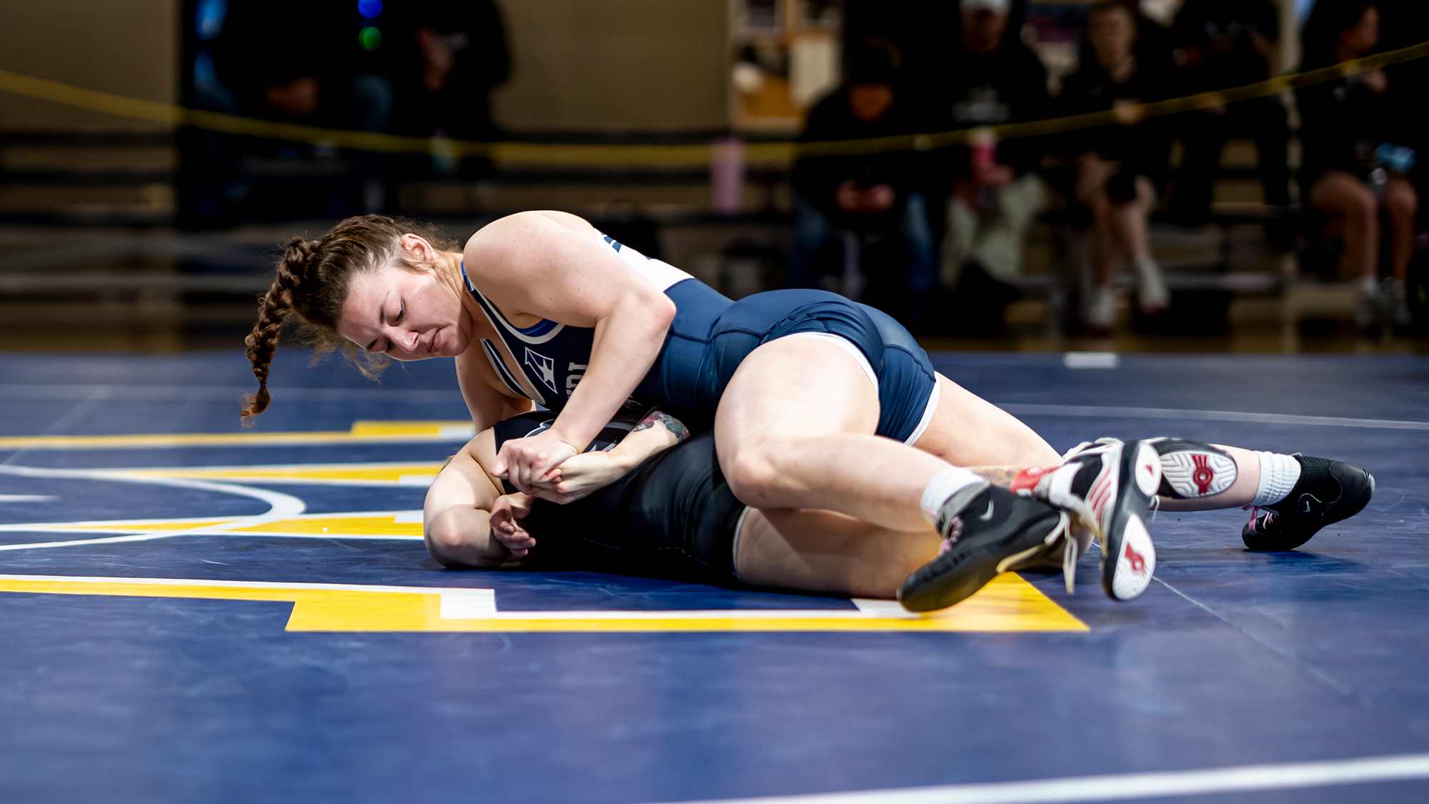 Maggie Ortmann works on top