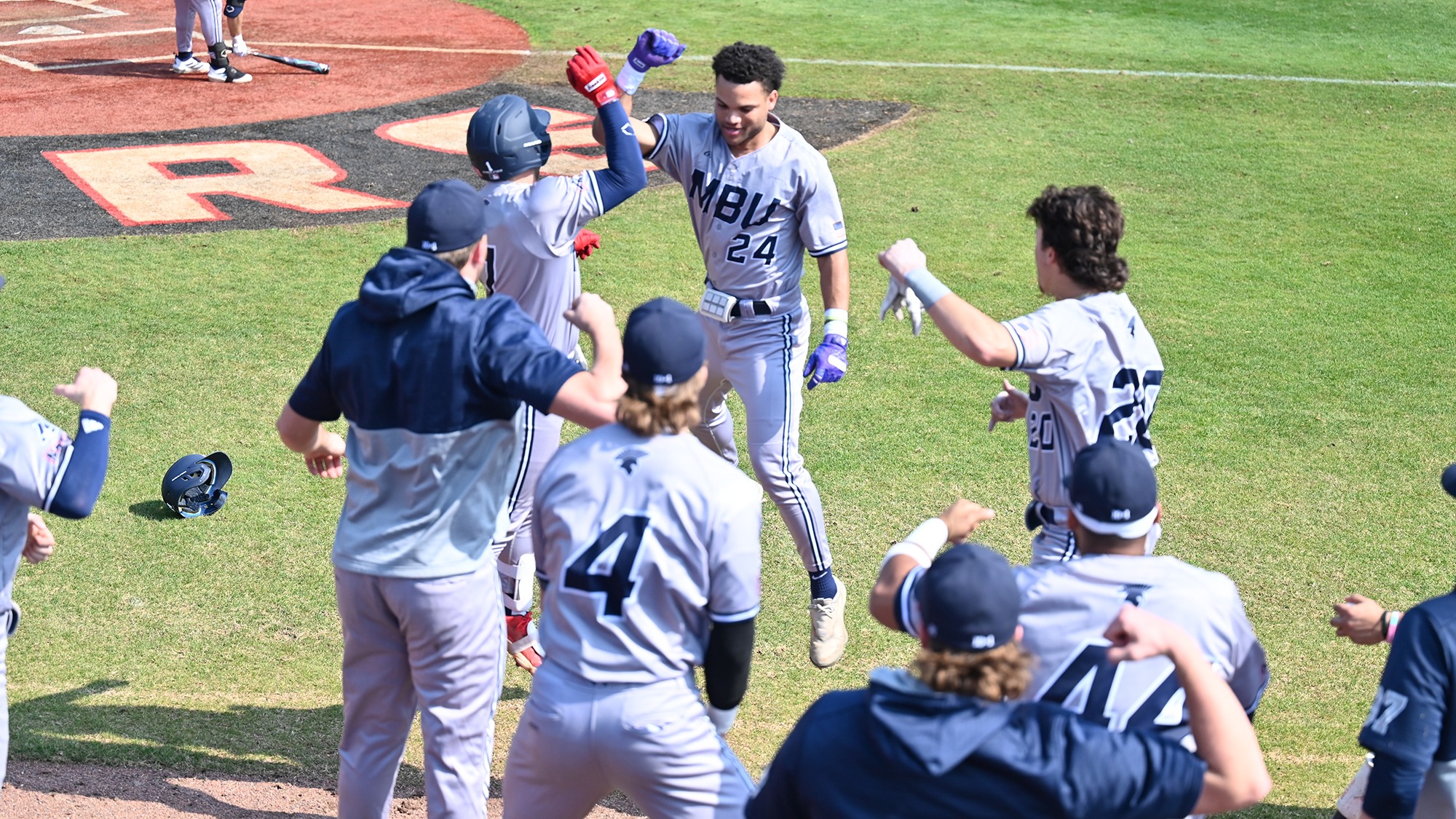 Carlos Hidalgo celebrates a home run vs No. 11 William Carey