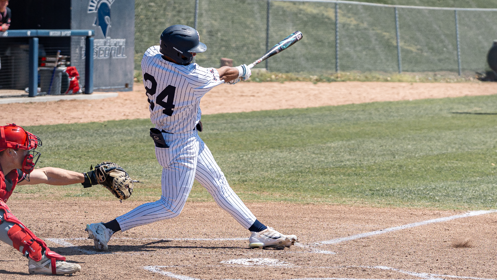  Carlos Hidalgo takes a swing vs Benedictine