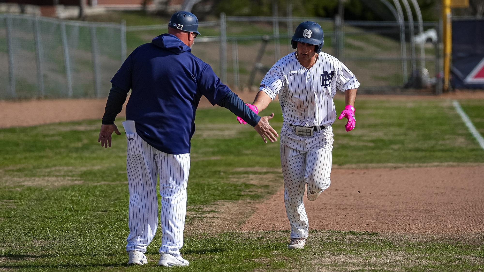 Max Shabestari hits a home run and rounds third base