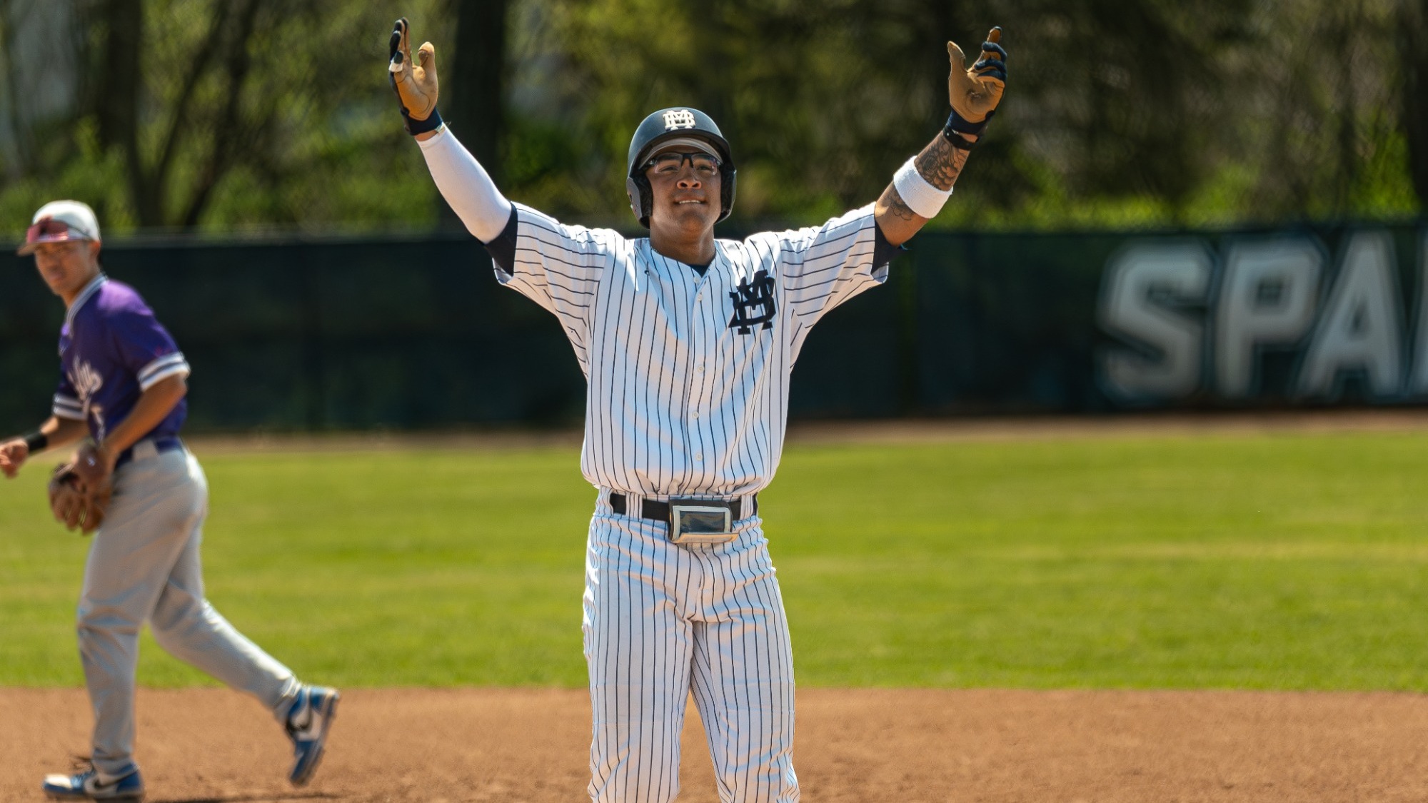 Nick Beech celebrates at first base vs Missouri Valley College
