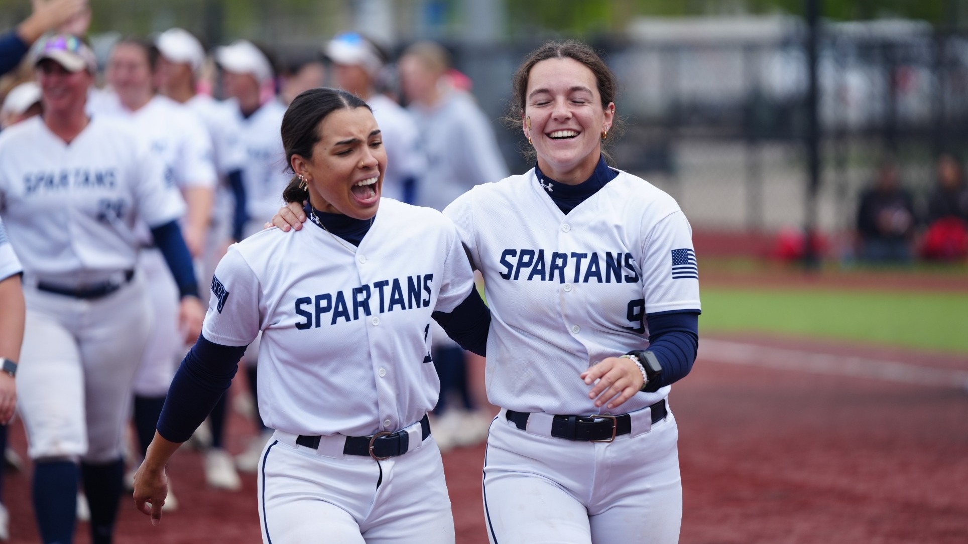 Johnson and Leigraf celebrate after Heart Conference Tournament win over Benedictine