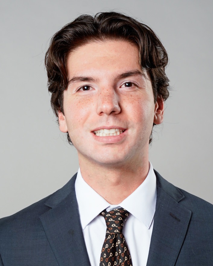 Matt Gross (head and shoulders mug shot in a suit jacket and tie)