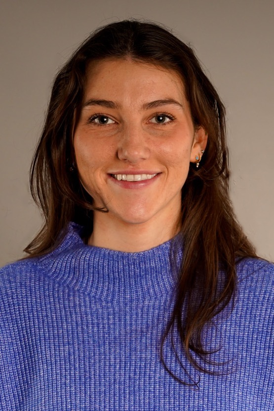 Lovin Marsicano (Head and shoulders mug shot in a purple sweater)