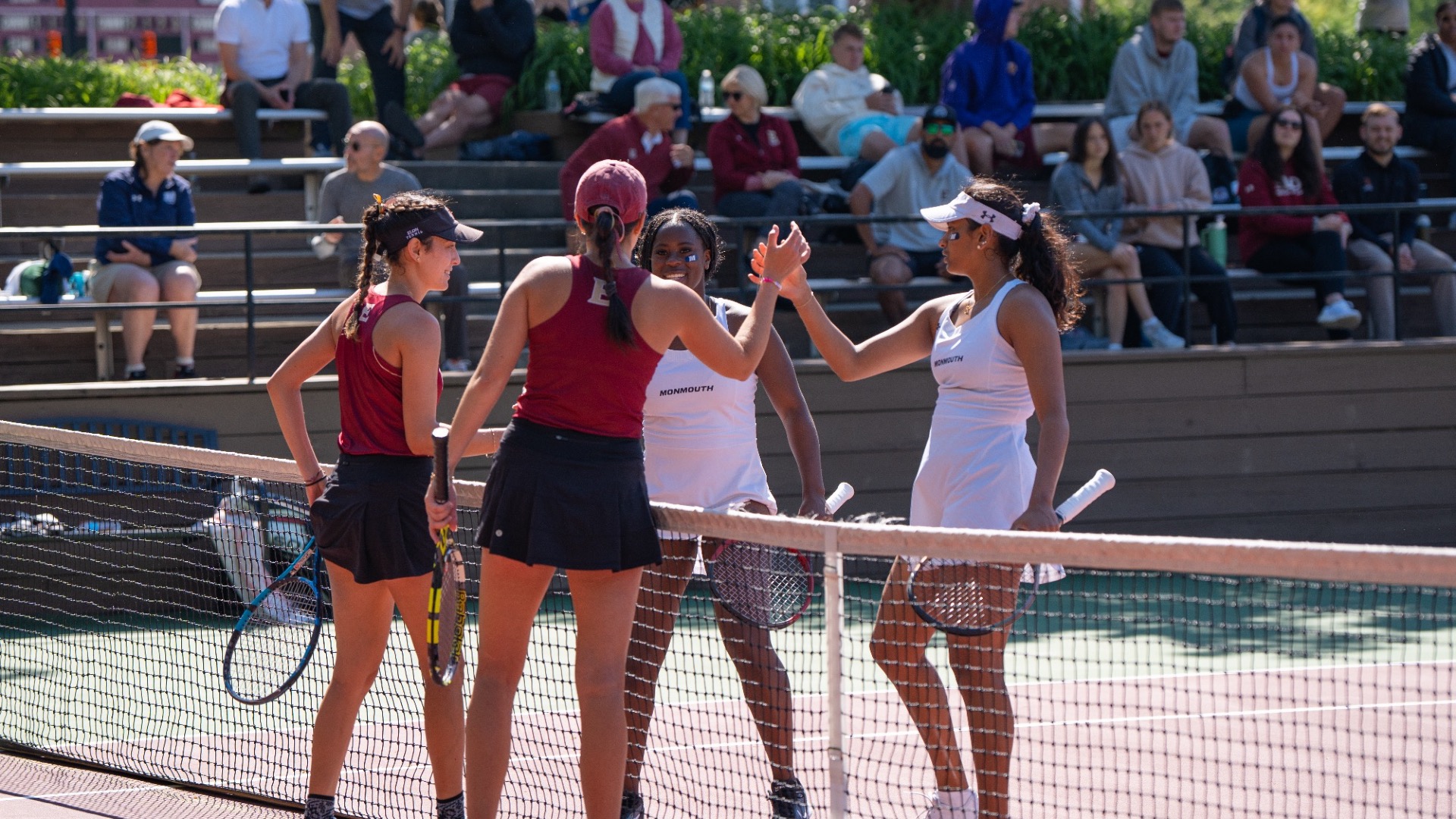 Nitika Girish and Madison Mills shake hands with opponents at the net