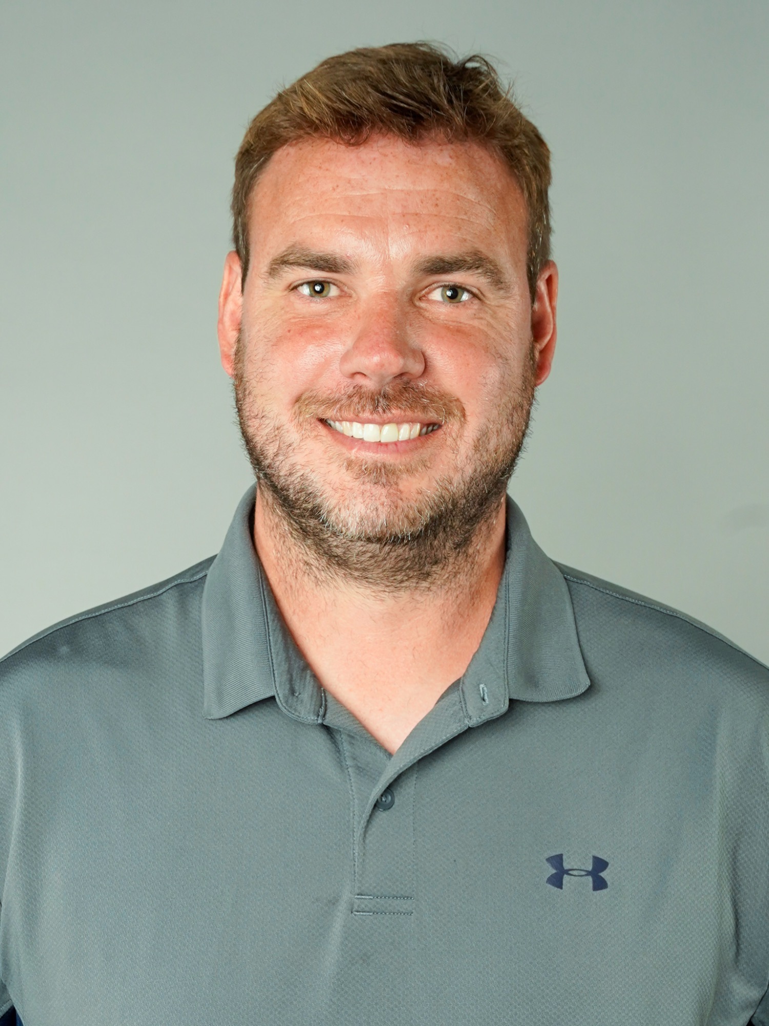 Hugh MacDonald (Head and shoulders mug shot in a gray golf shirt)