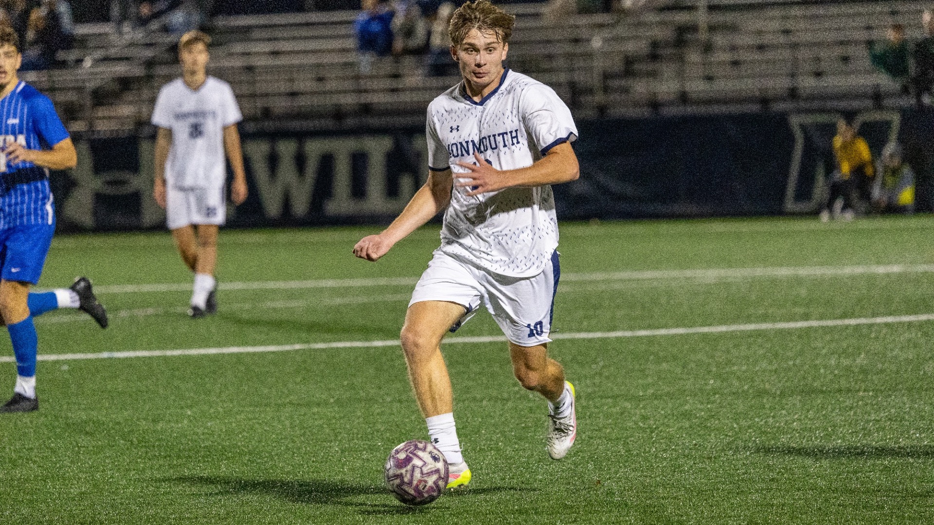 Patrick Osiecki dribbles the ball up field