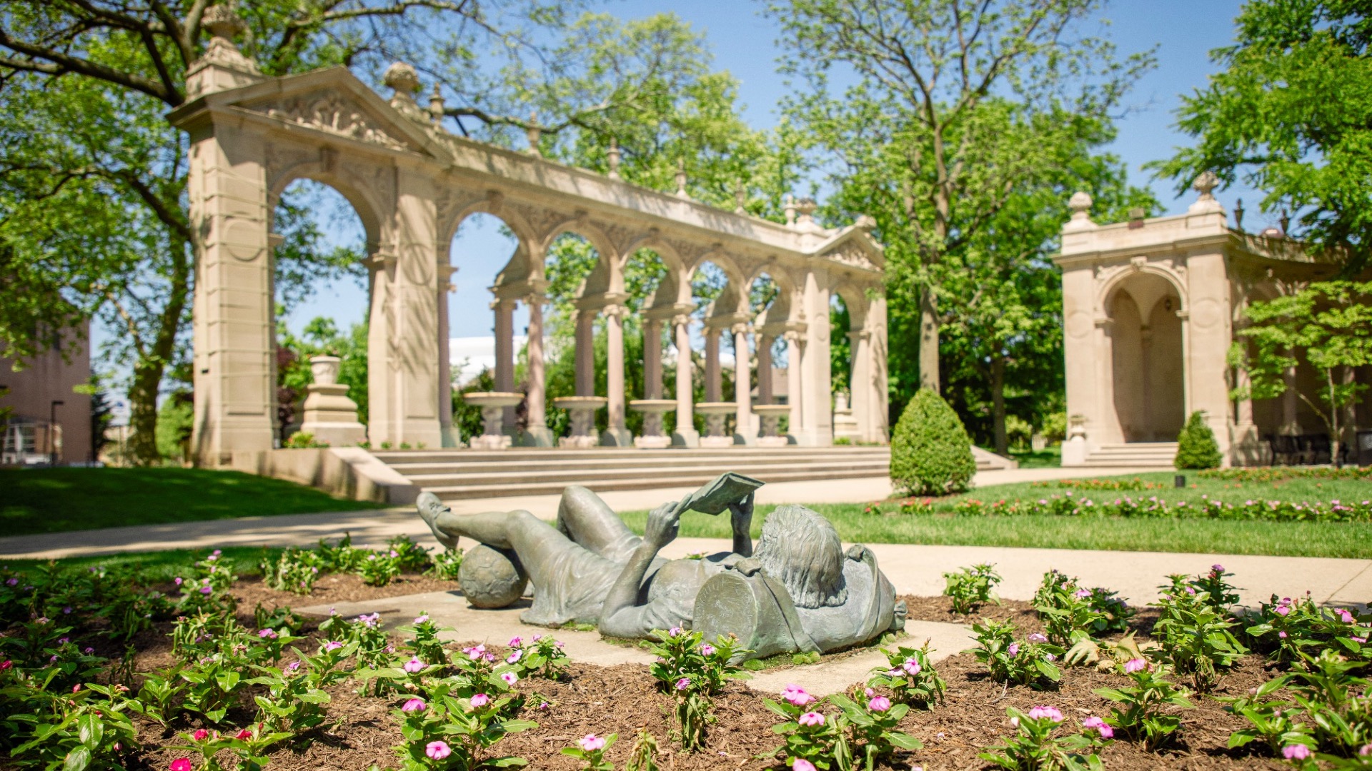 Great Hall Gardens and statue reading spring time (Campus Shots)