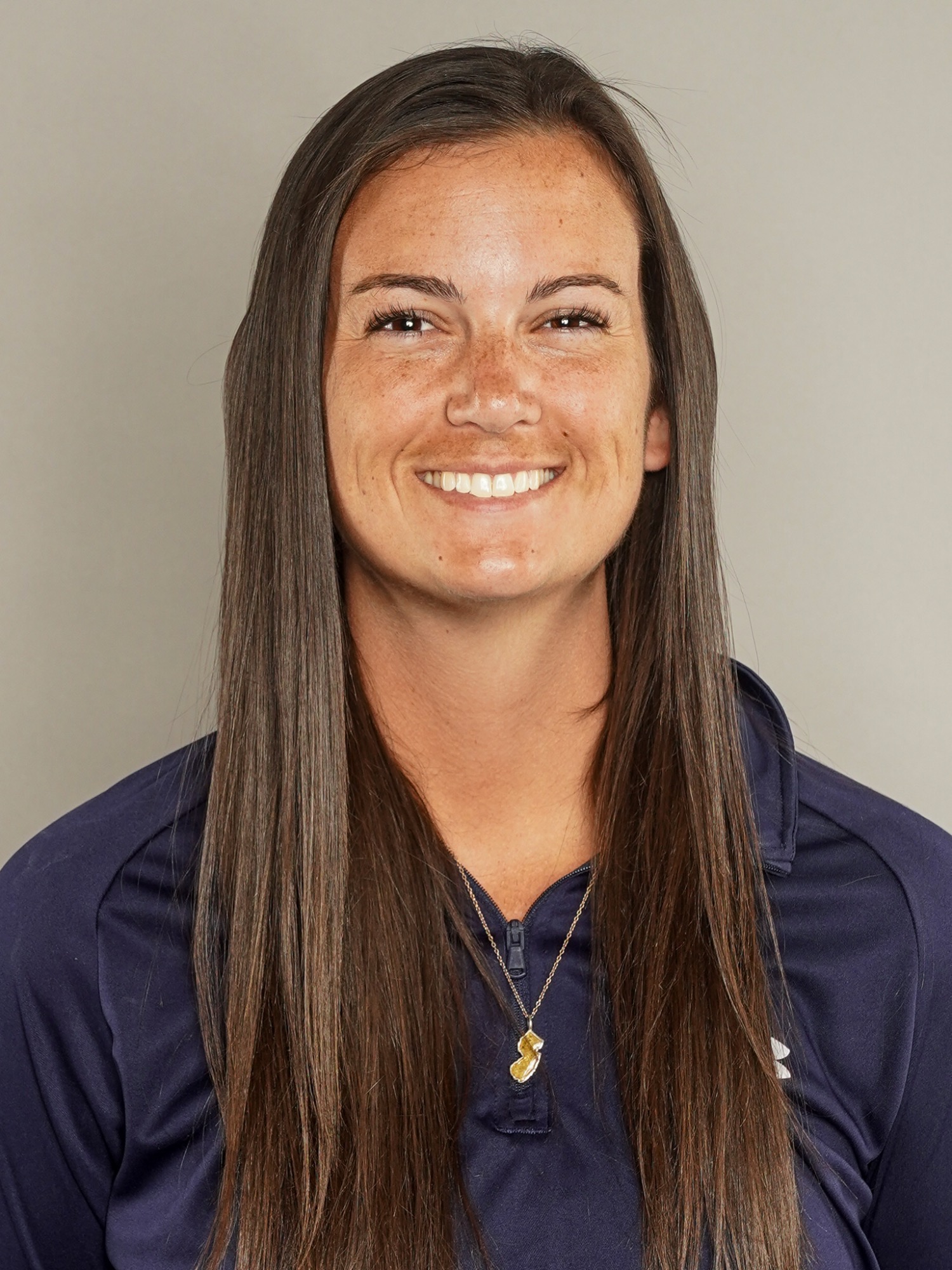 Kim Egan (head and shoulders mug shot in a blue quarter zip)