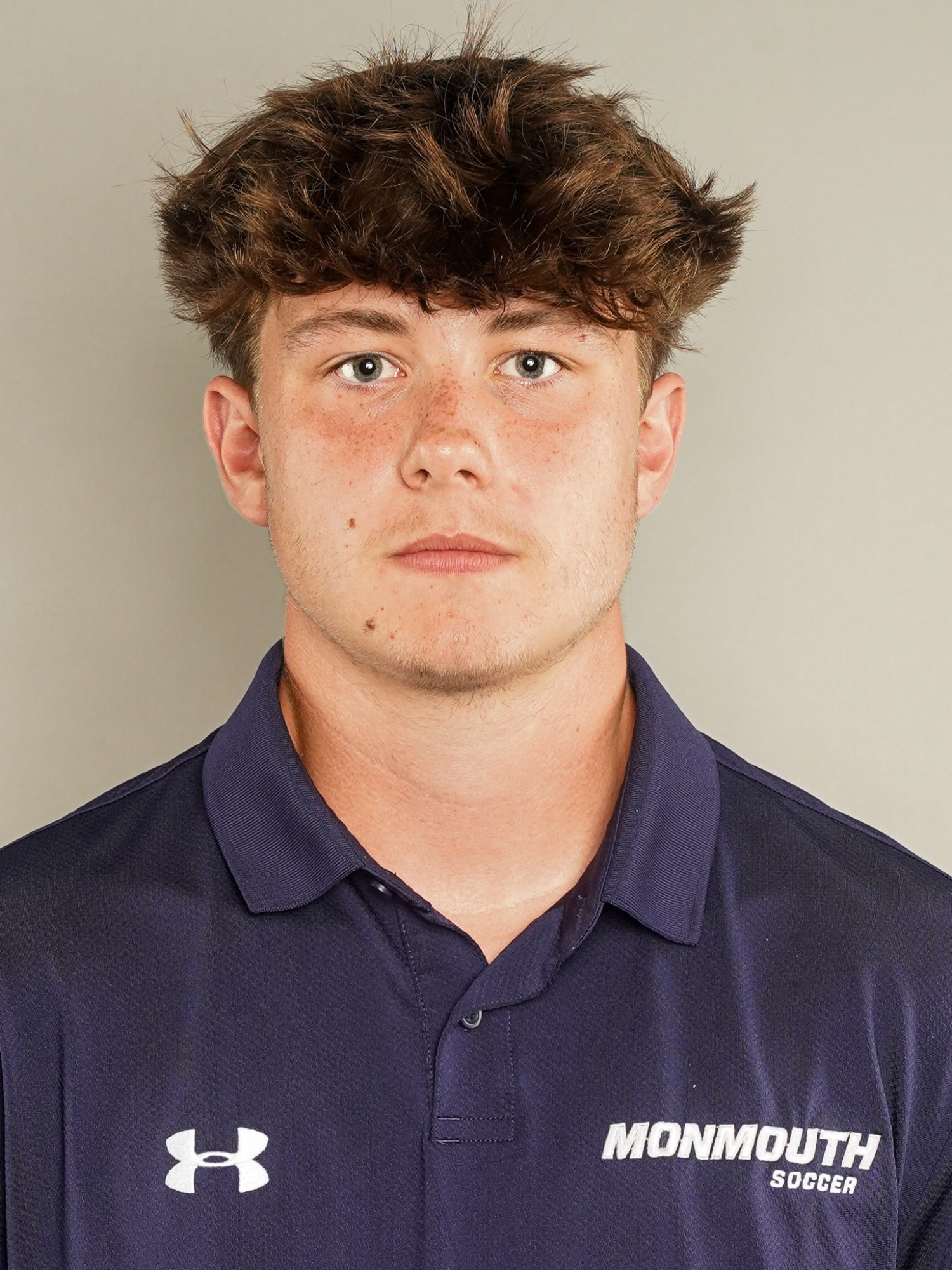 Charlie Schemer (head and shoulders mug shot in a blue polo shirt)