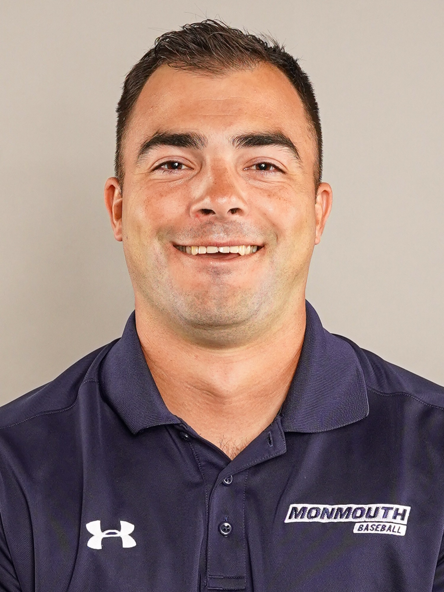 Trey Stover (head and shoulders mug shot in a blue polo with the Monmouth baseball logo)