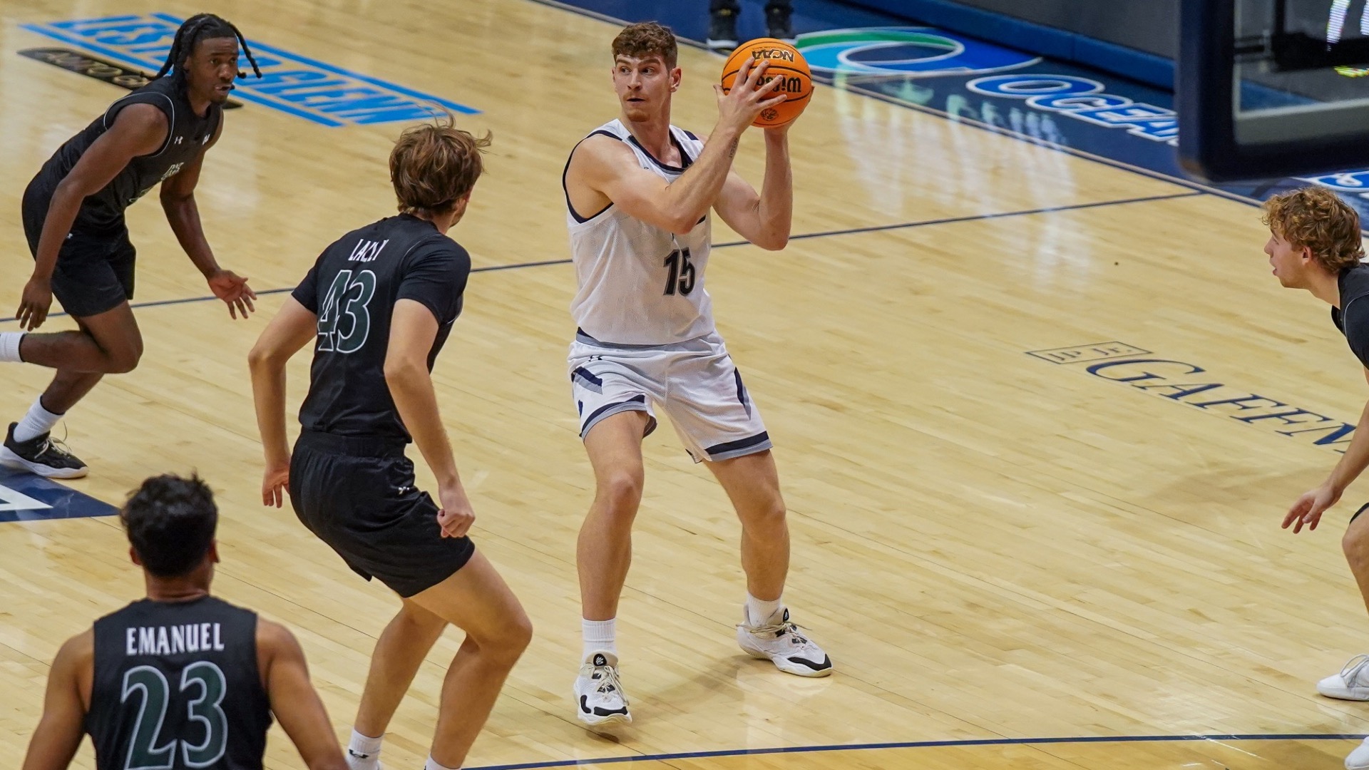 Stefanos Spartalis stands at the top of the key looking to pass