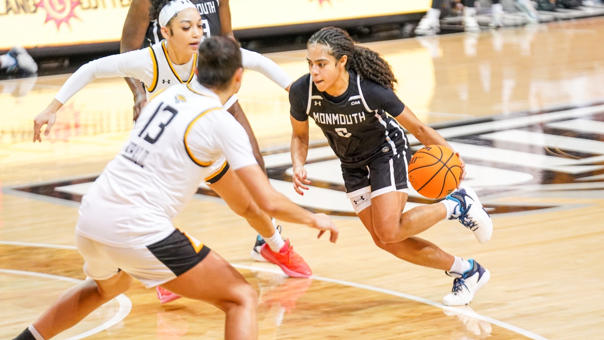 Gigi Gamble drives in the lane past a defender