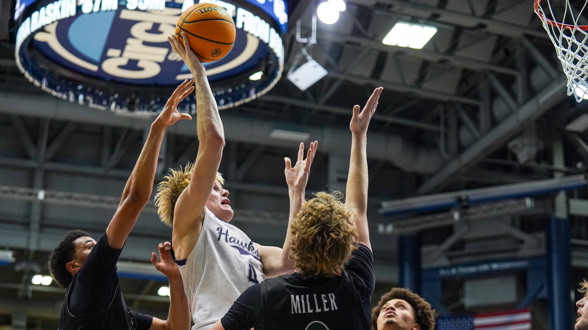 Andrew Ball goes up among defenders for a basket