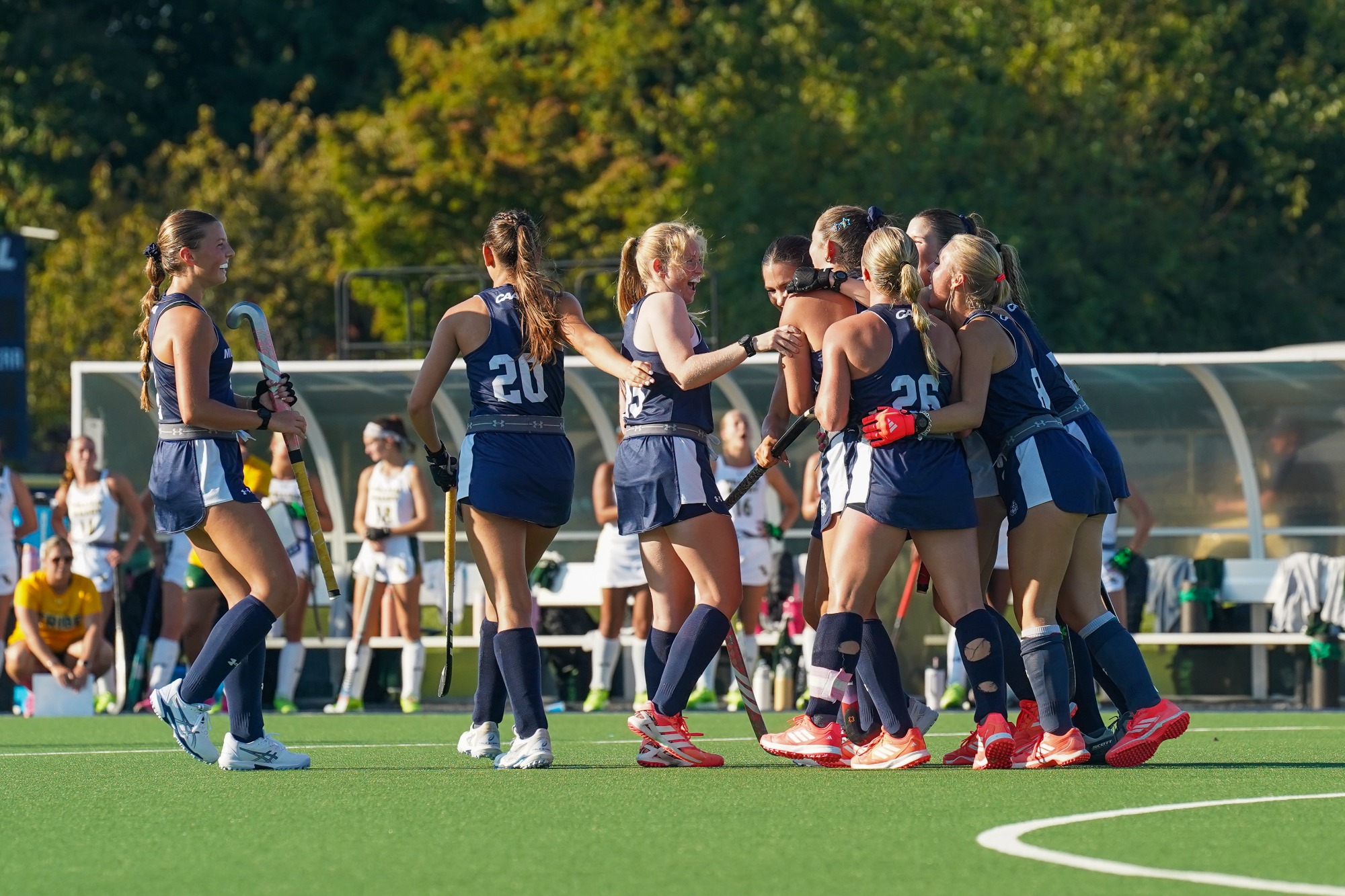 team celebrates after Olivia Oliver scores her first career goal 