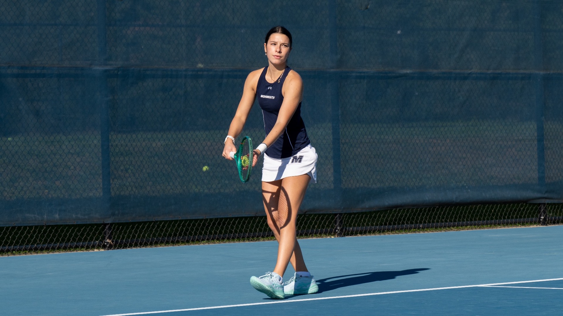 Emilia Julin - Women's Tennis vs. Wagner 10.7.26 (Julin stands ready to serve the ball)