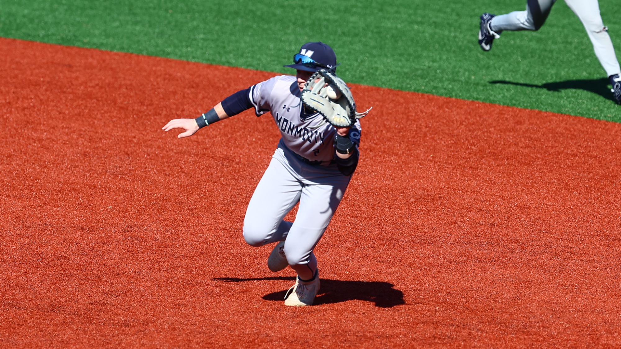 Chris Walsh grabs the ball as he runs to first (BASE at Richmond 2.13.26)