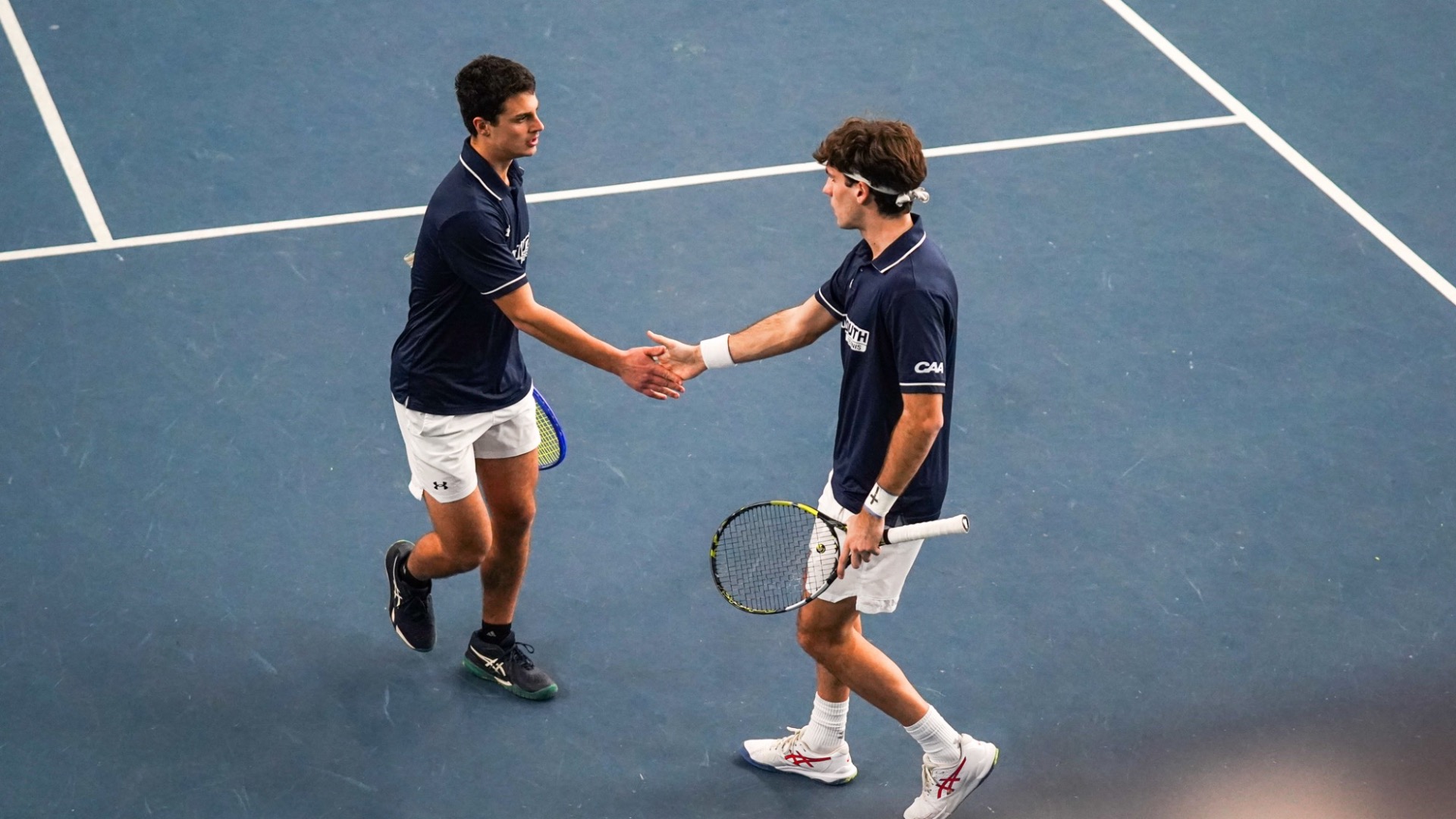 Alex Martinez Sanz and Sasha Vysochenko slap hands on the court