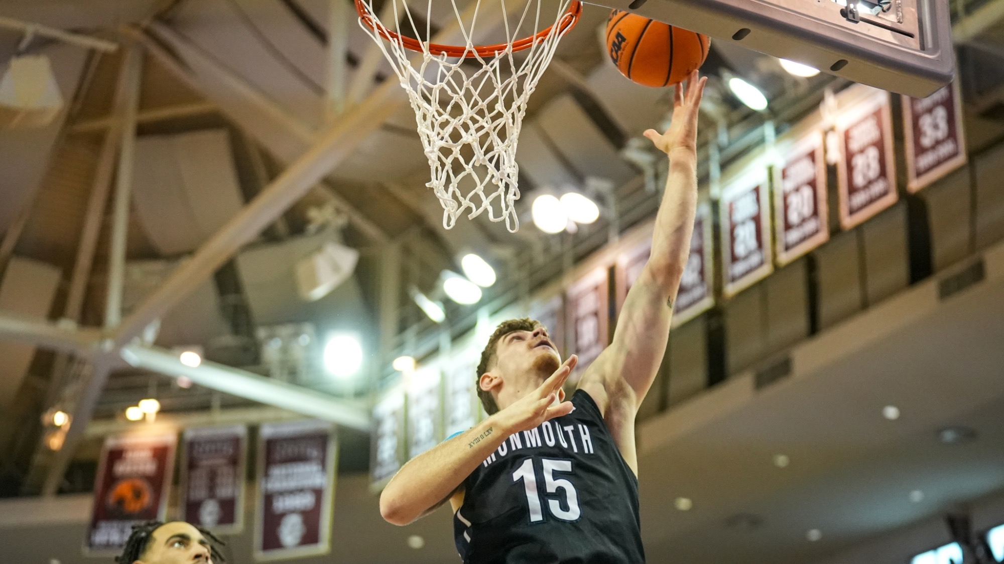 Stefanos Spartalis rises towards the net shooting a layup