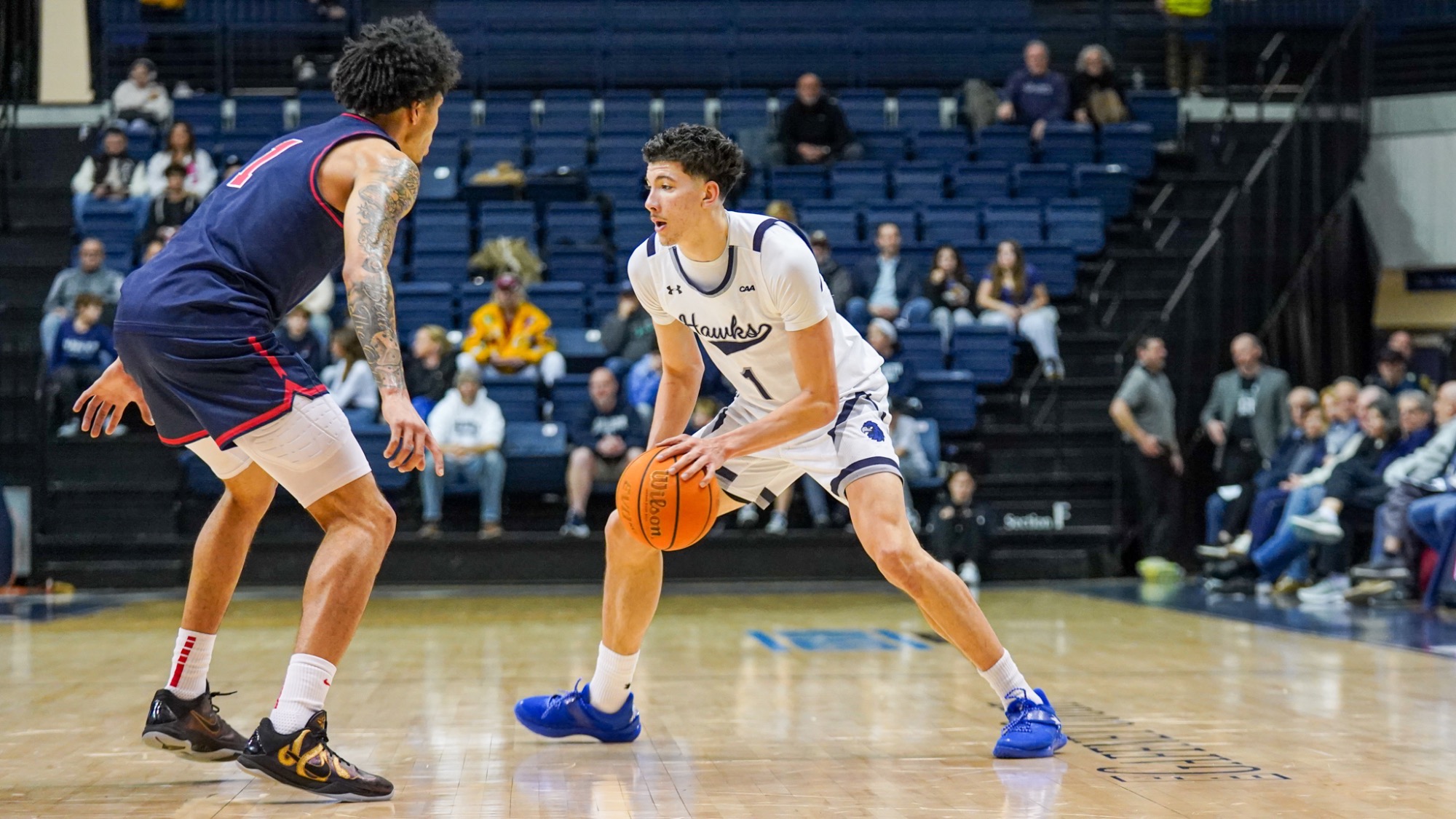 Jason Rivera-Torres dribbles and looks to move around a defender