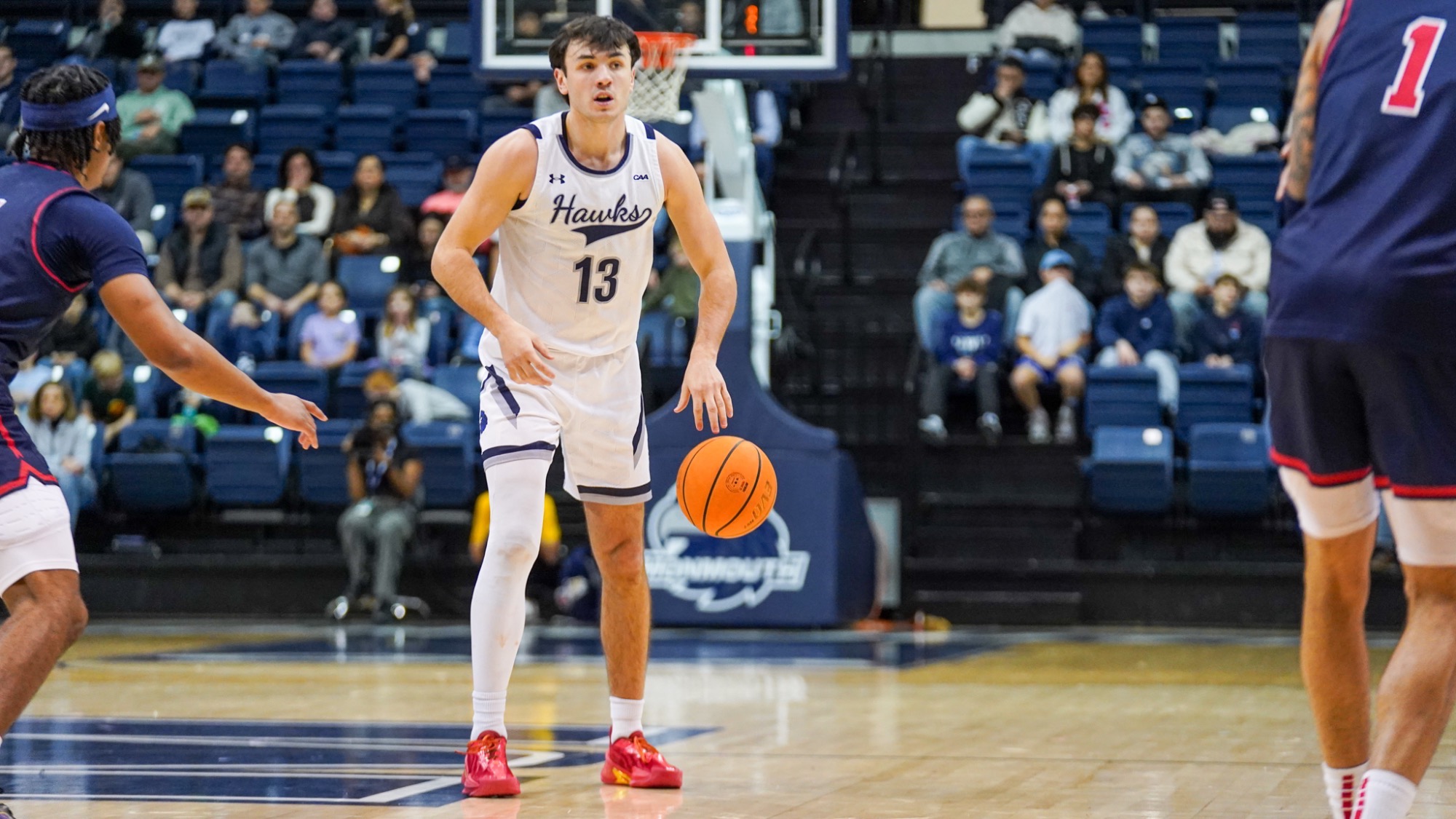 Jack Collins stands with the ball looking to pass