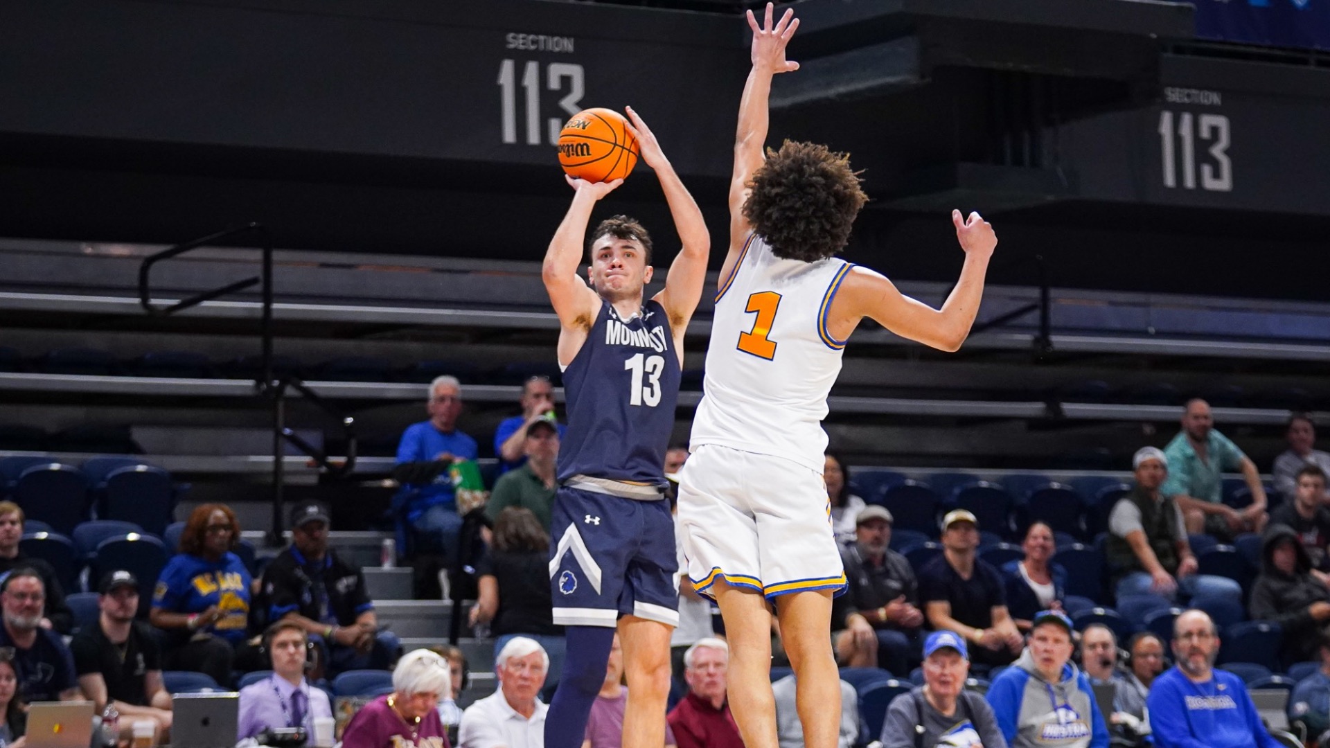 Jack Collins goes up for a shot as the defender comes flying in