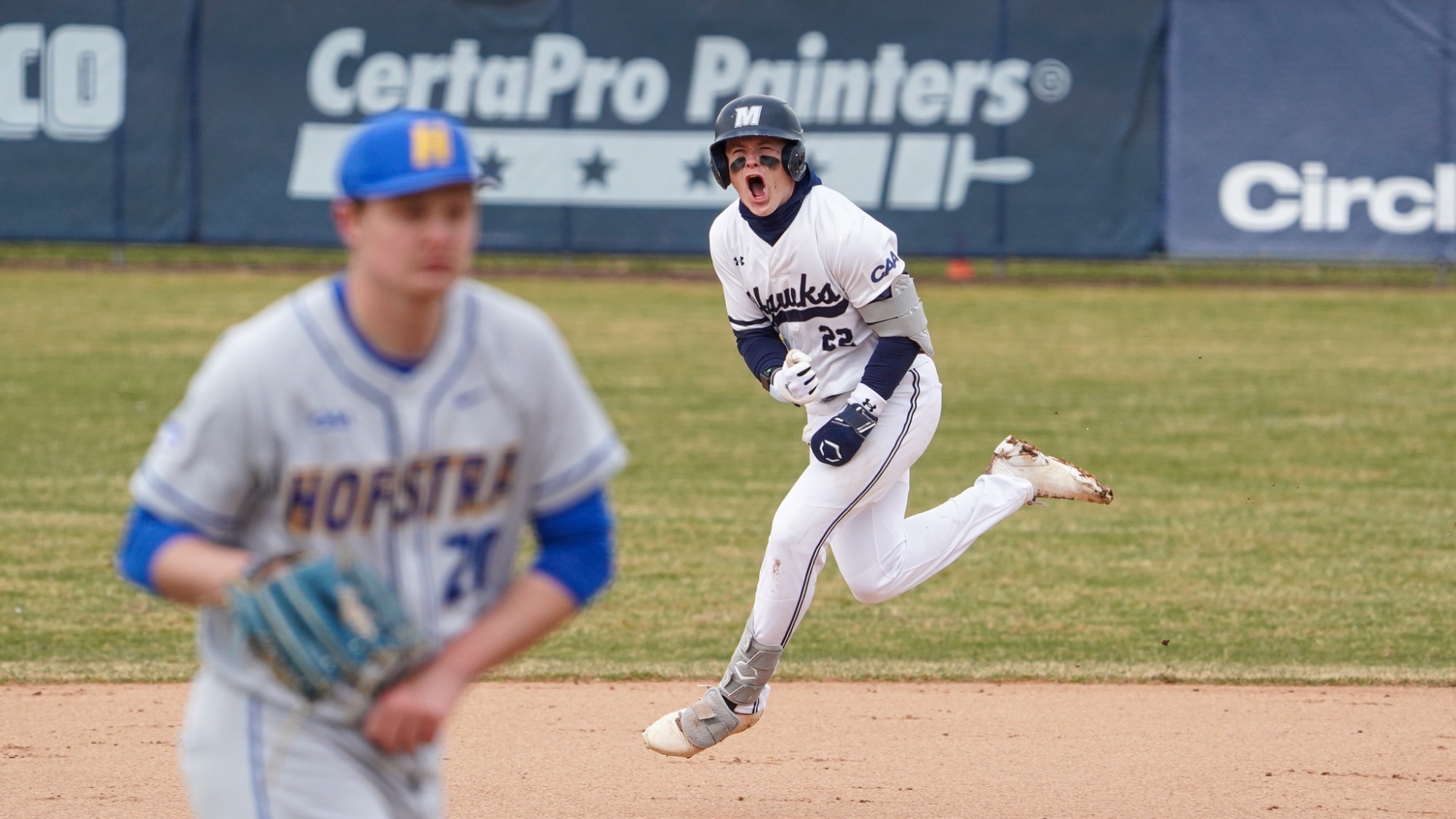 RJ Mustaro jumps in the air and screams while rounding the bases after a home run